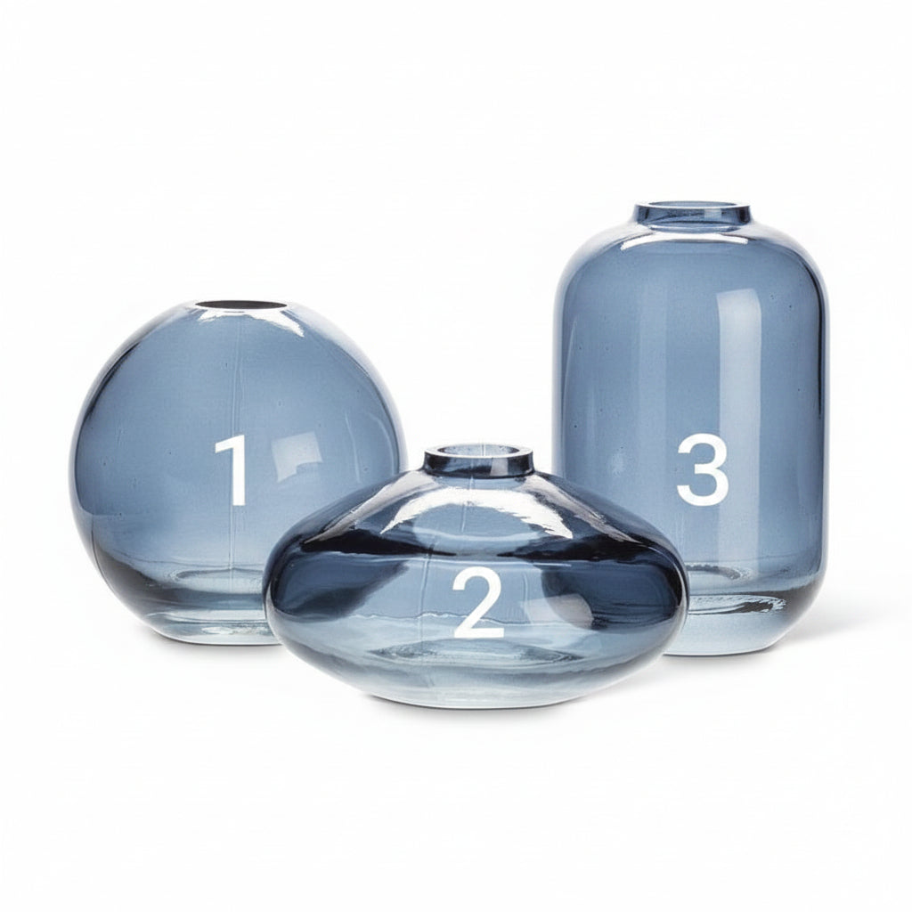 Dark blue glass bud vases, grouped