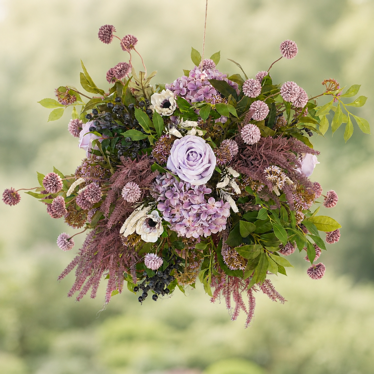 Lavender Drift floral chandelier in a soft green garden
